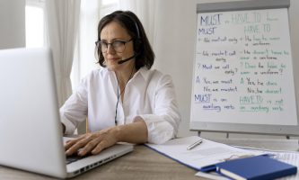 english-teacher-doing-her-class-with-whiteboard-scaled